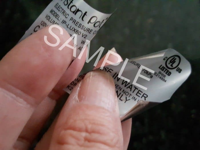 Instant Pot silver sticker cut in half