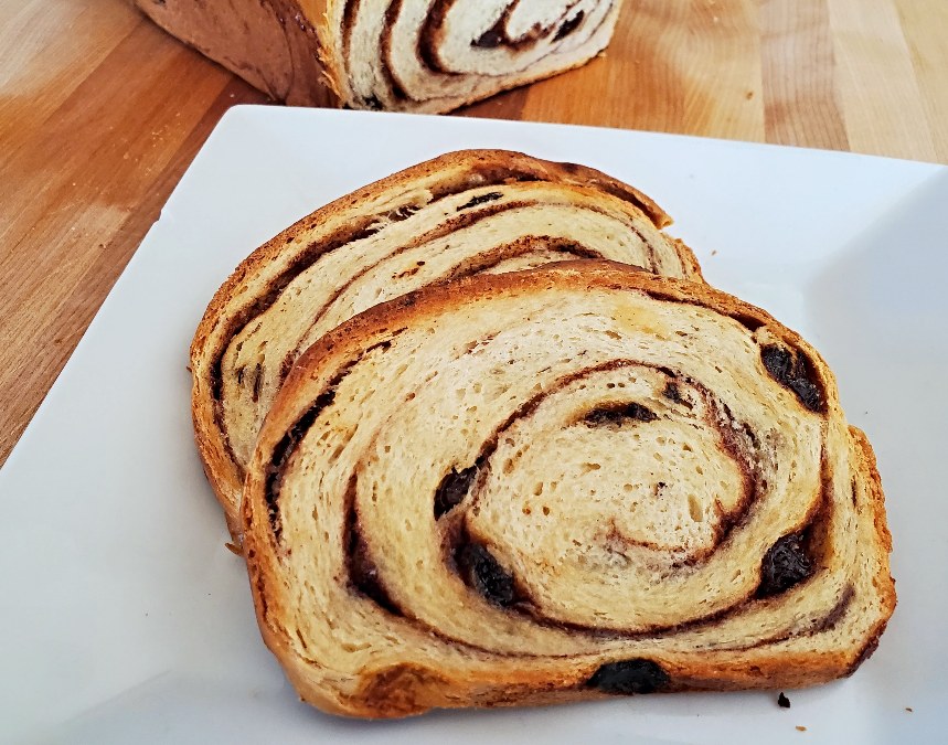 Slices of toasted cinnamon raisin bread on a plate