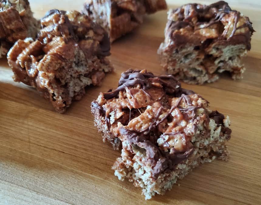 Close up of peppermint cereal bars on a wooden tray