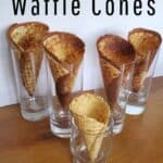 5 waffle cones standing in glasses to cool.