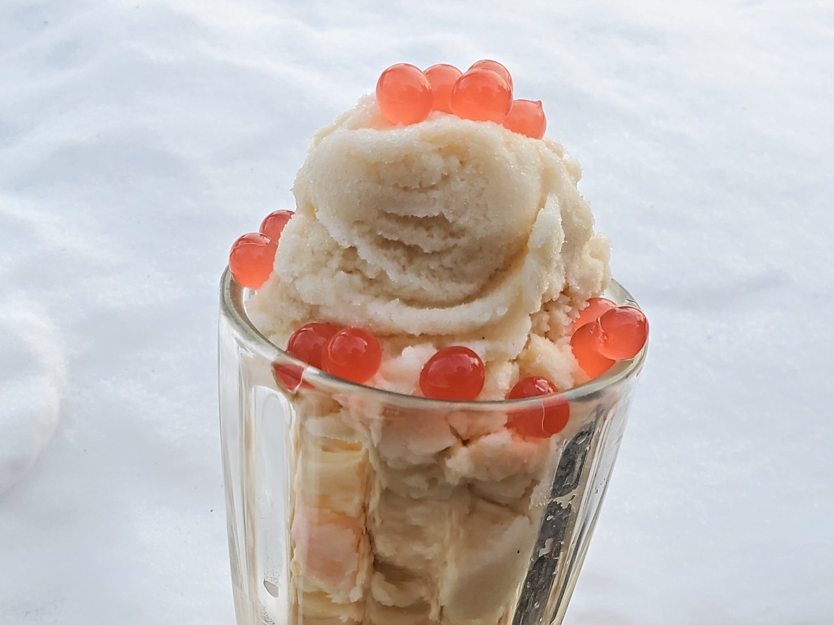 Close up of brown sugar snow cream with strawberry boba.