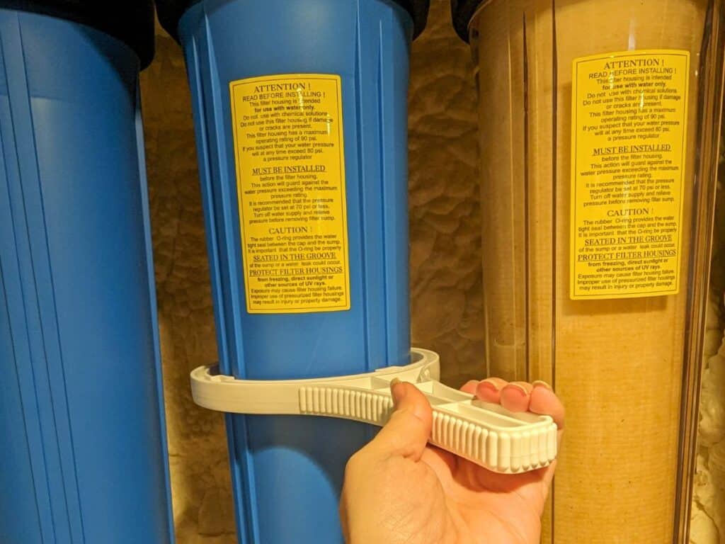 Image shows Changing the filter on an Express Water Whole House Filter.