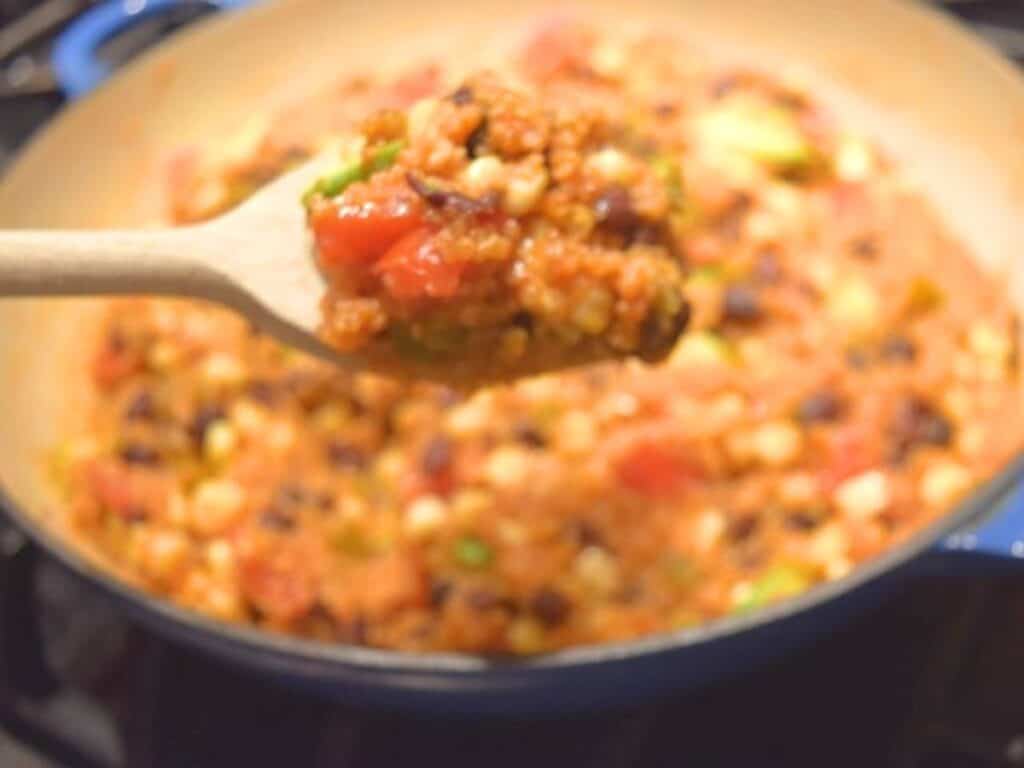 Image shows s spoonful of Mexican skillet quinoa.