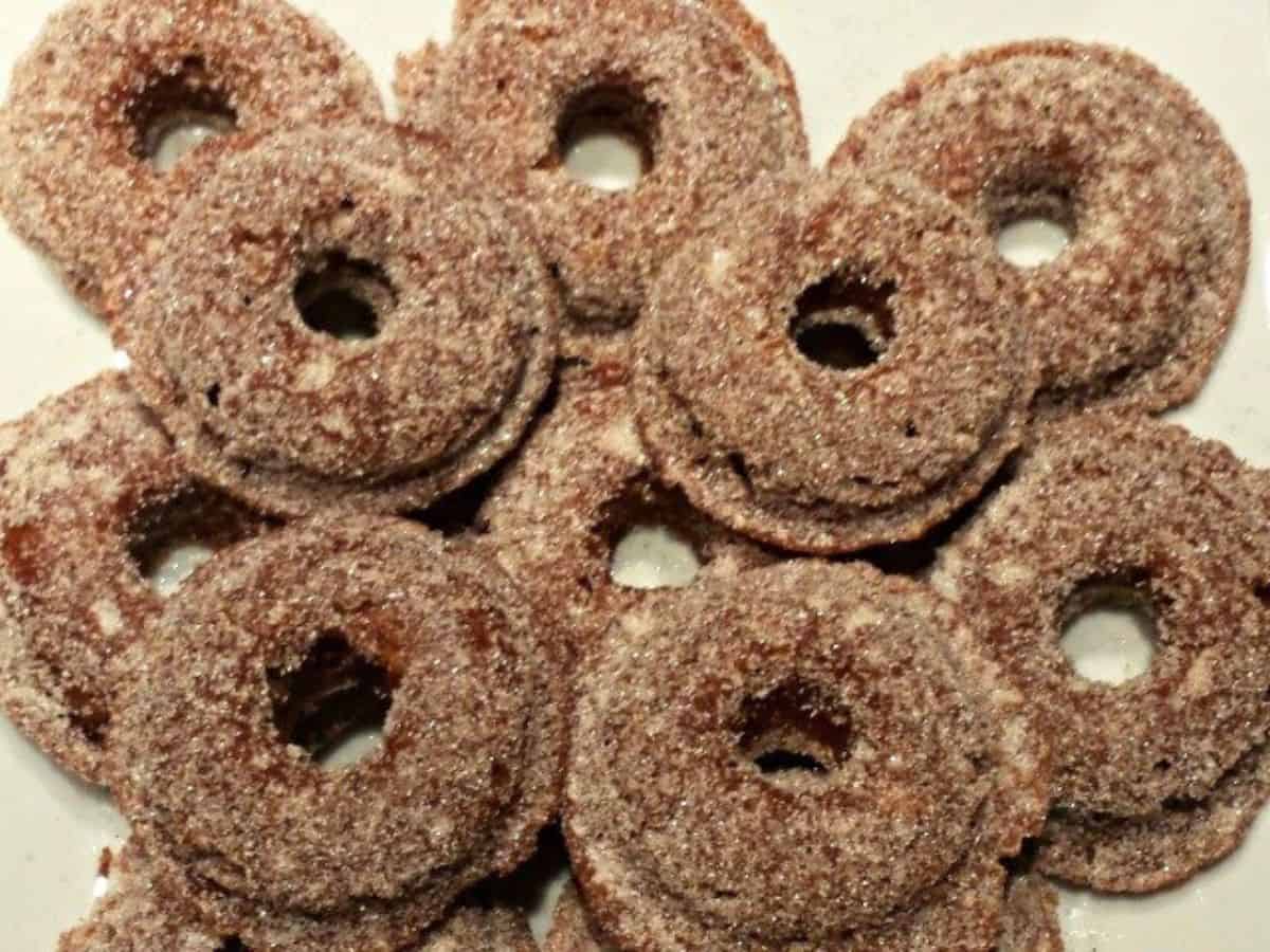 Overhead of a stack of baked apple cider donuts.