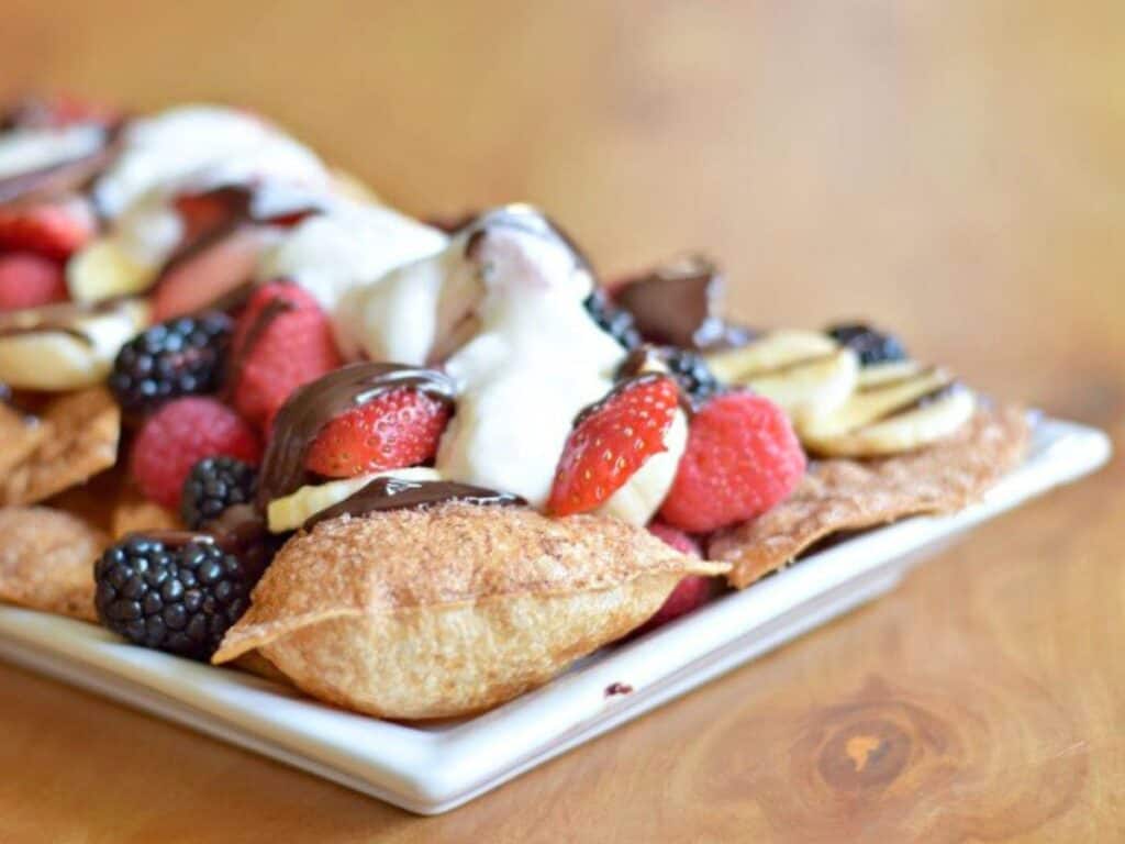 Image shows delicious dessert nachos on a platter.
