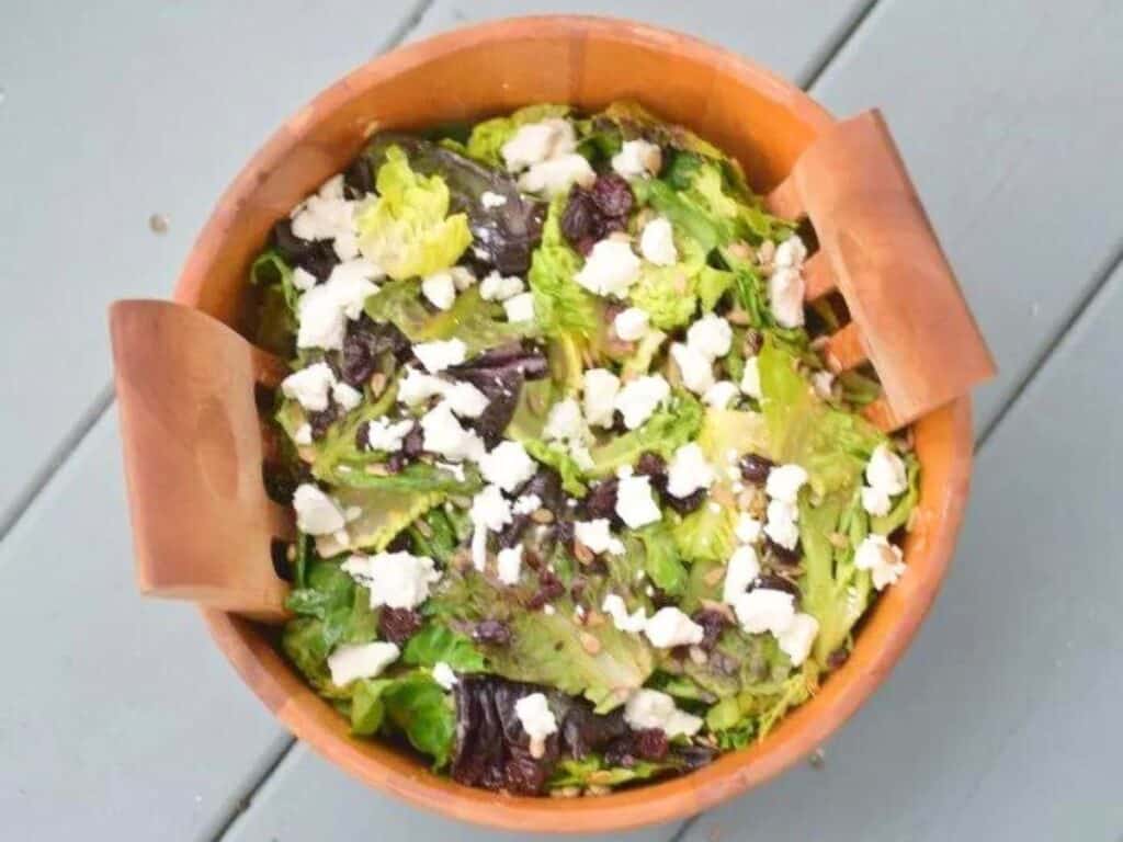 Image shows easy to make goat cheese and dried cherry salad.