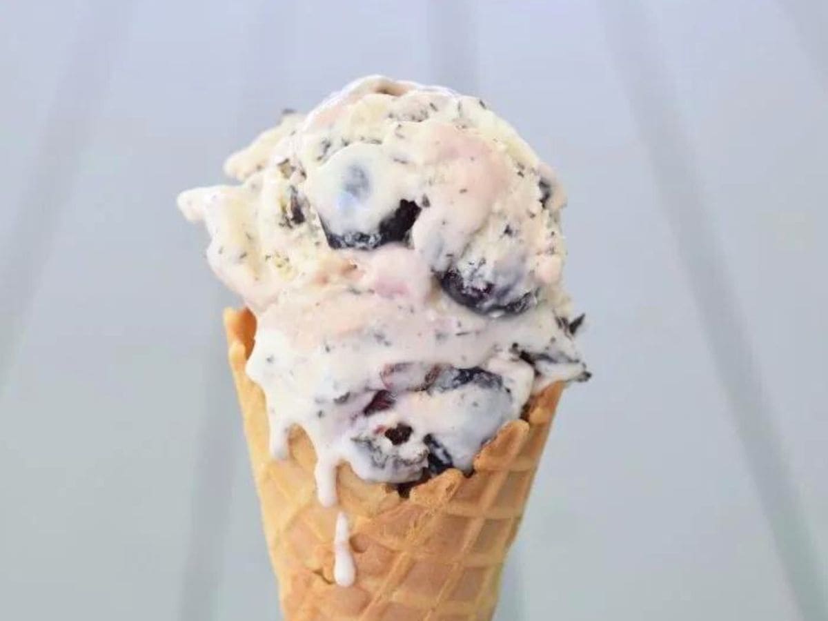 Cherry Chip ice cream in a cone with drips.
