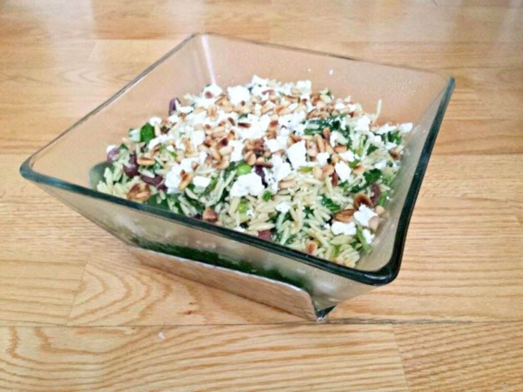 Image shows yummy spinach orzo salad ready to serve.