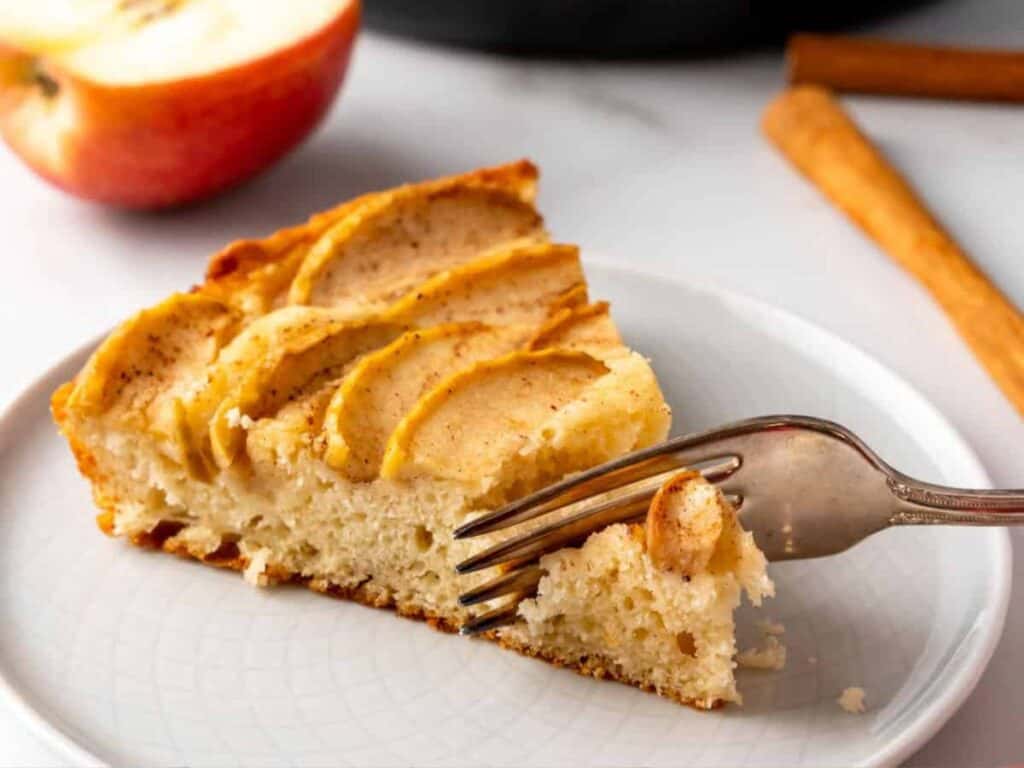 Image shows apple cake with cinnamon recipe.