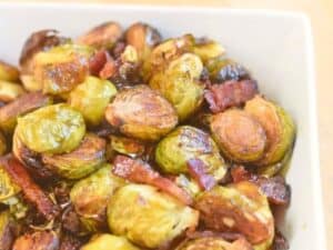 Image shows delicious bacon roasted Brussels sprouts.