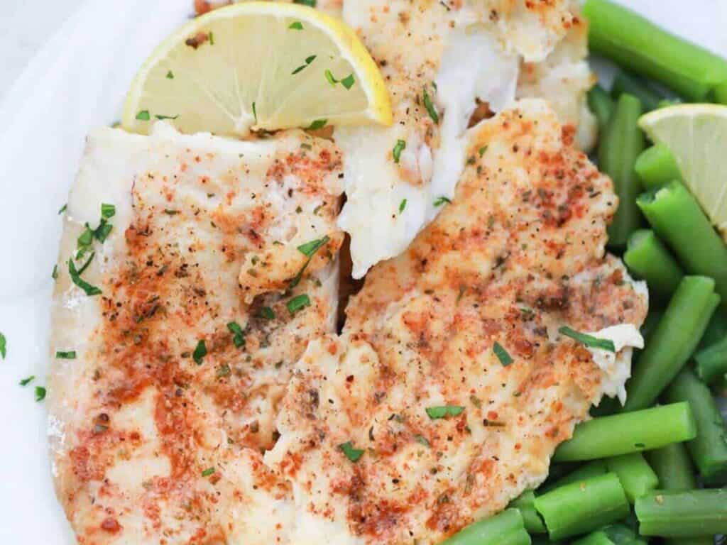Image shows irresistible baked lemon butter fish.
