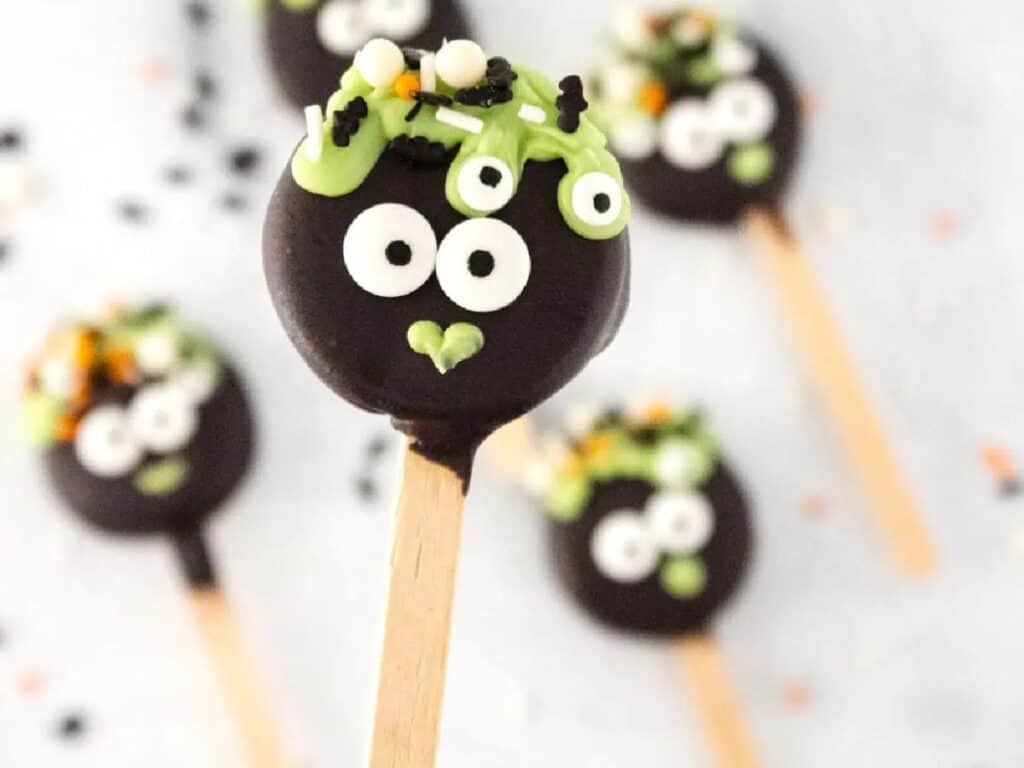 Image shows delicious Halloween cauldron pops.