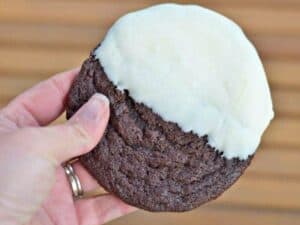 Image shows delicious triple chocolate dipped cookie.