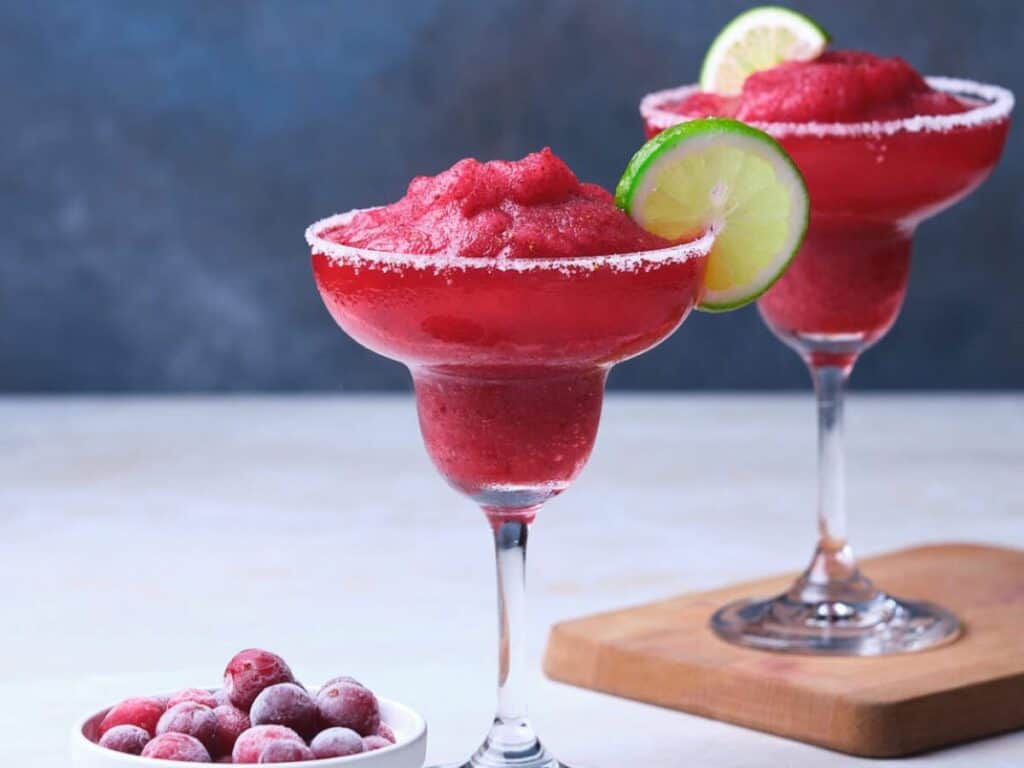 Image shows easy to make frozen cranberry margarita.
