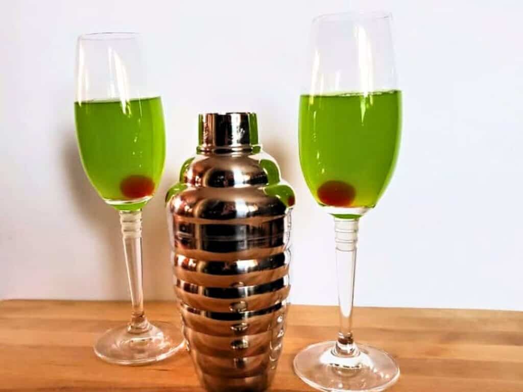 Image shows easy to make sweet and sour Grinch cocktail.
