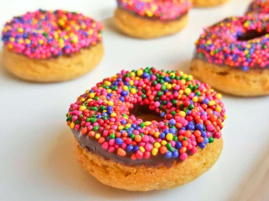 Image shows delicious and yummy homemade chocolate-frosted donuts.