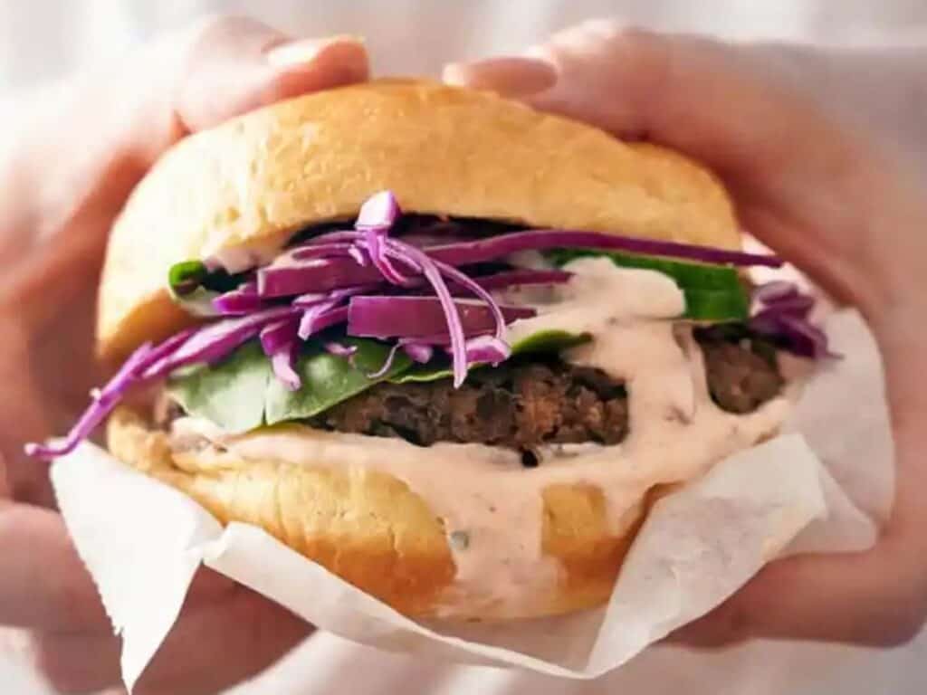 Image shows irresistible black bean burger.