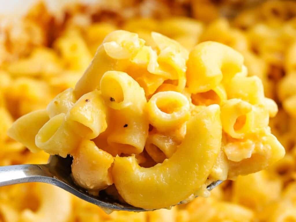 Image shows yummy crock pot mac and cheese.