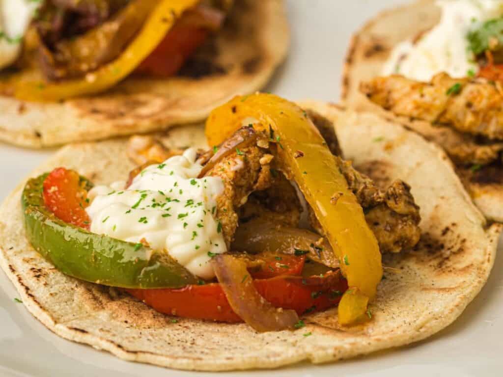 Image shows air fryer chicken fajitas recipe.