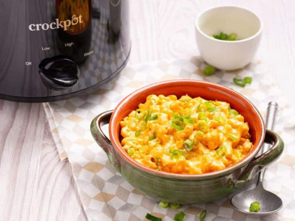 Image shows yummy crock pot mac and cheese.