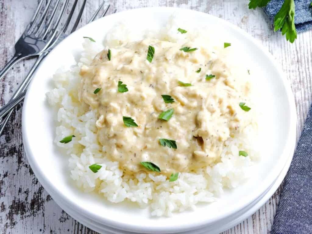 Image shows delicious slow cooker creamy chicken.