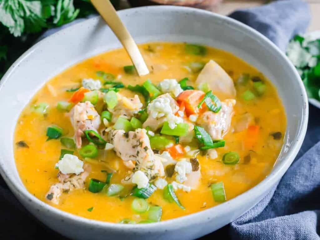 Image shows easy to make Instant Pot buffalo chicken orzo soup.