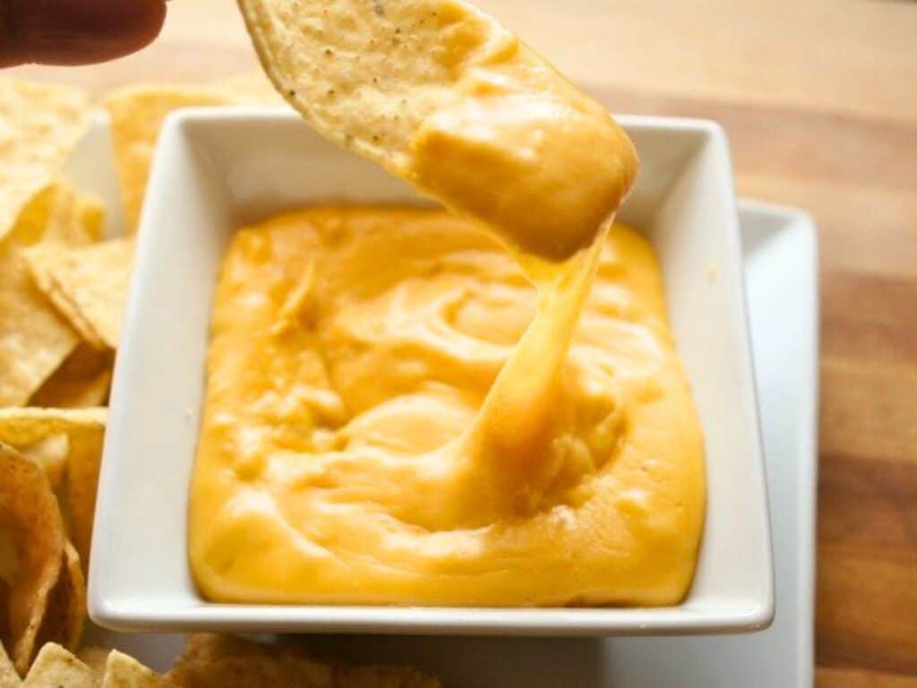 Image shows easy to make gooey nacho cheese sauce.