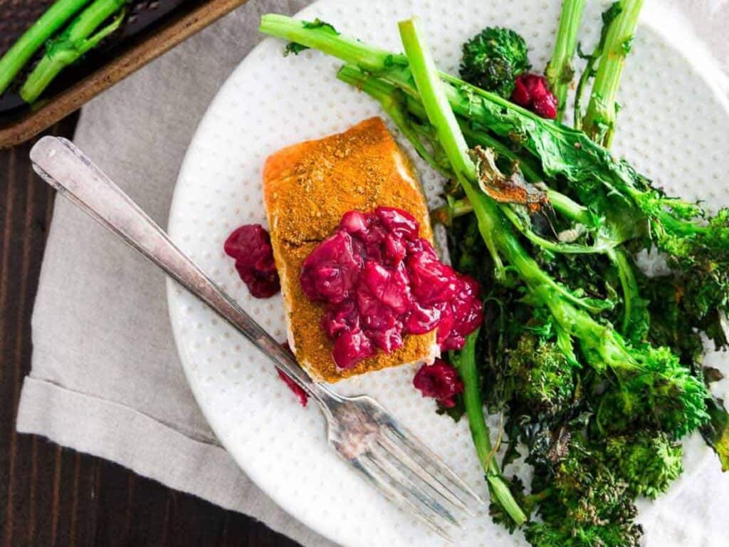 Image shows easy to make sheet pan turmeric salmon.