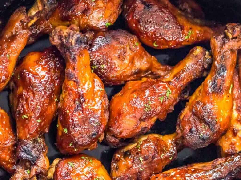 Image shows easy to make slow cooker bbq chicken legs.
