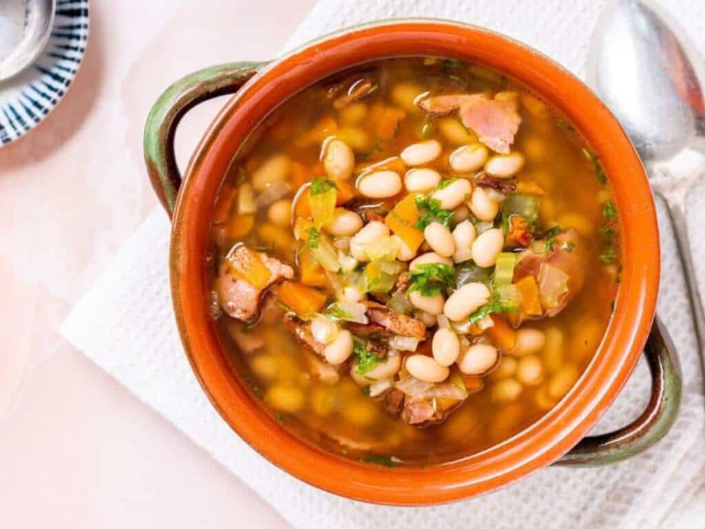 Image shows irresistible navy bean and ham soup.