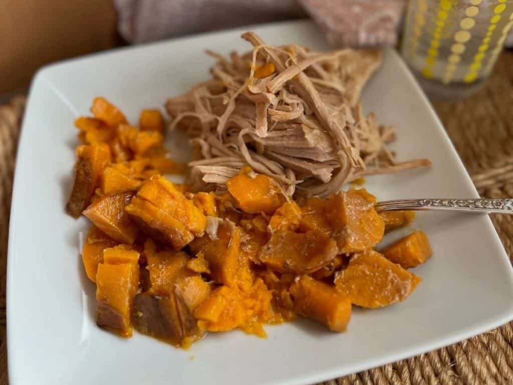 Image shows irresistible pork loin in the crock pot.