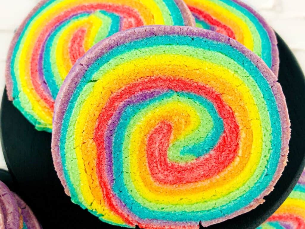 Image shows irresistible rainbow pinwheel sugar cookies.