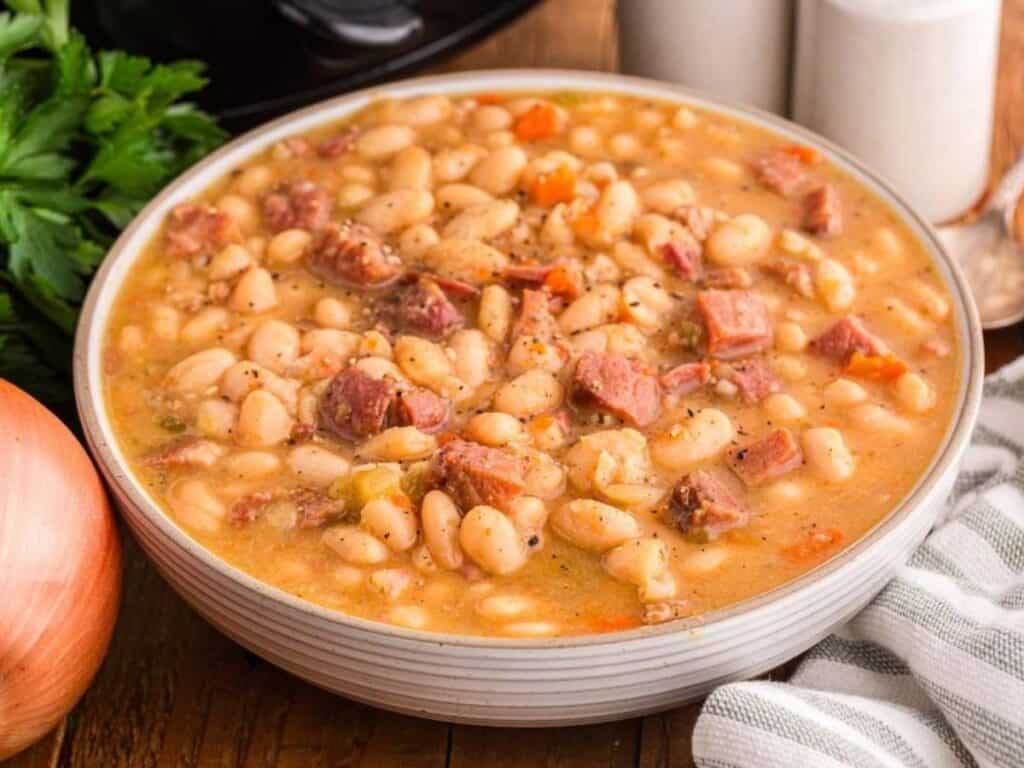 Image shows slow cooker ham and bean soup recipe.