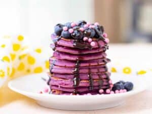 Image shows yummy and easy purple pancakes.