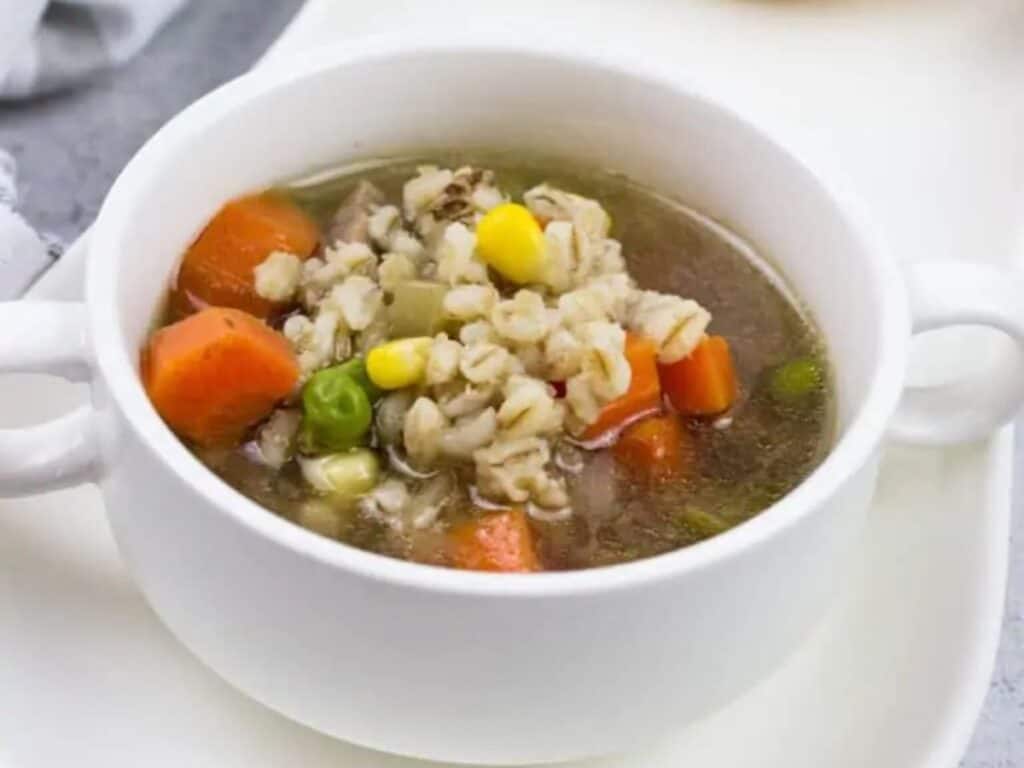 Image shows yummy beef and barley soup.