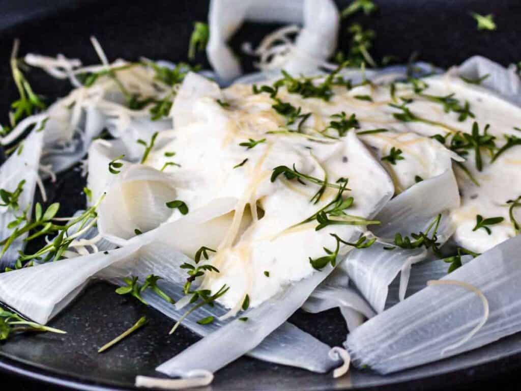 Image shows delicious asparagus pasta tagliatelle.