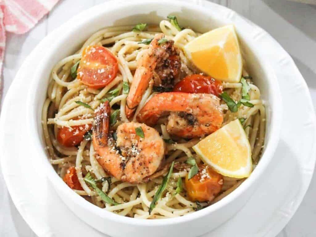 Image shows easy to make shrimp and tomato pasta.