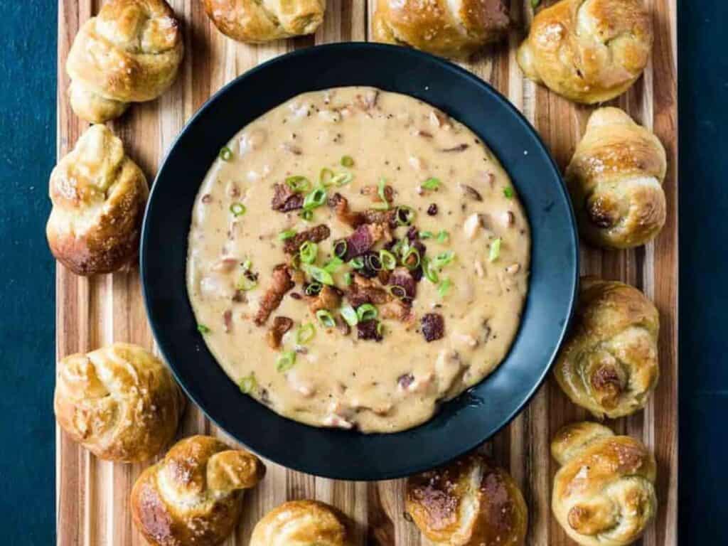 Image shows irresistible beer cheese dip with bacon.