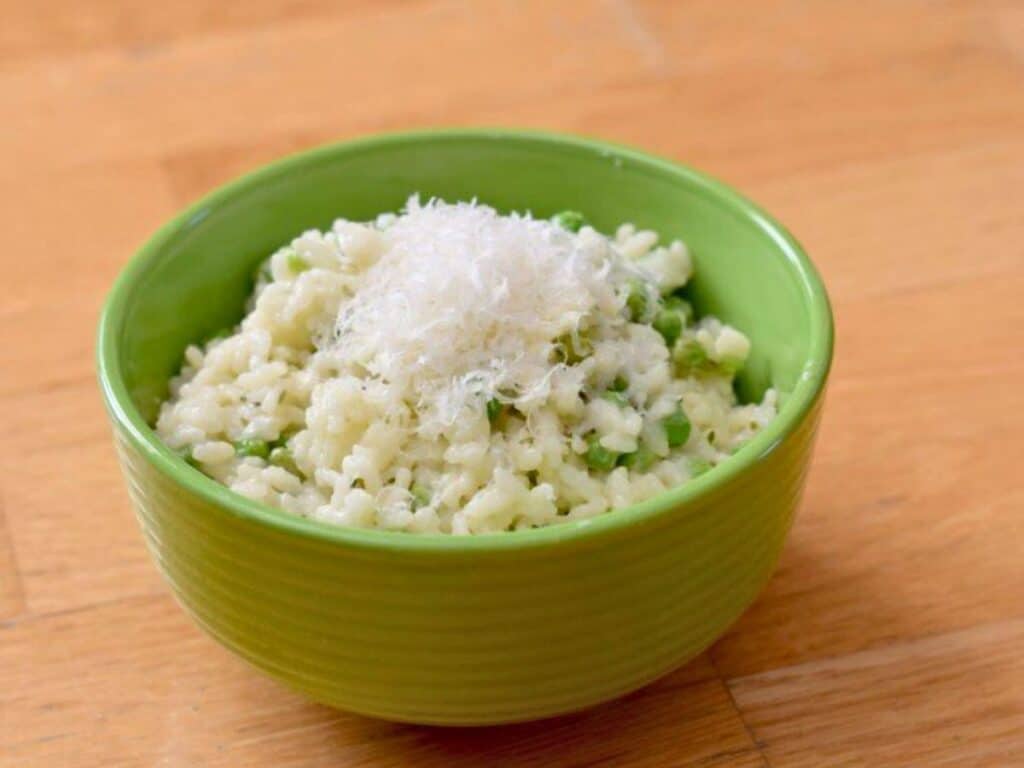 Image shows yummy risotto with peas and lemon.