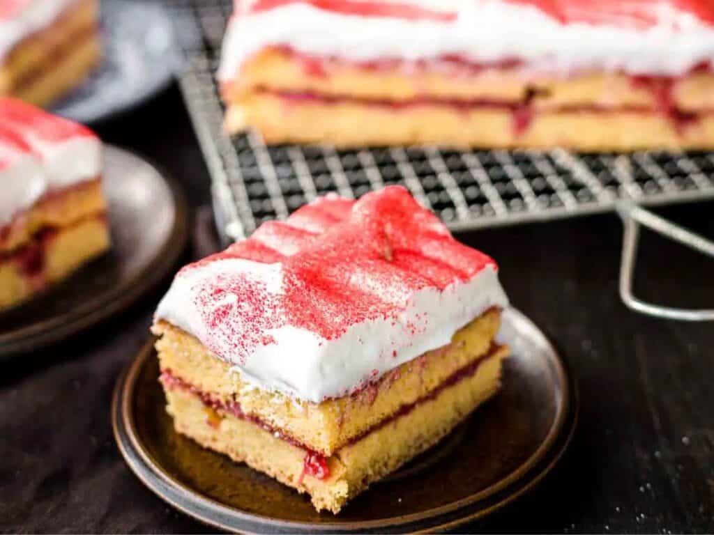 Image shows yummy strawberry sheet cake.