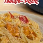 Image shows a Plate of pasta with text simple tomato pasta.