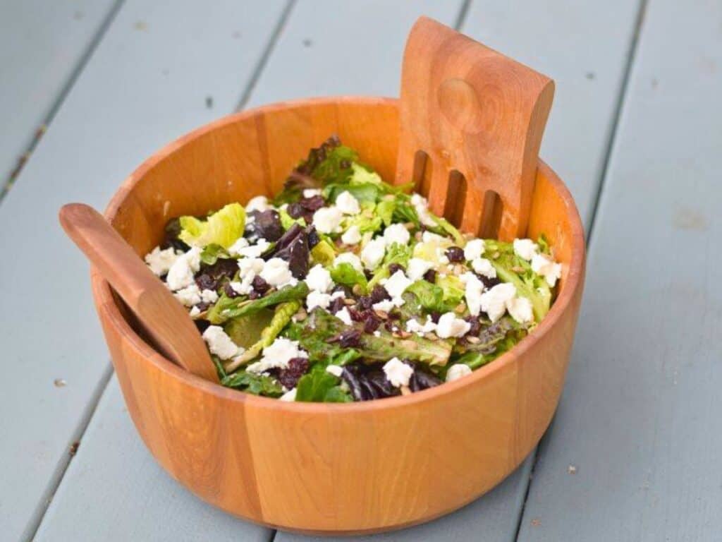 Image shows bowl of yummy goat cheese and dried cherry salad.