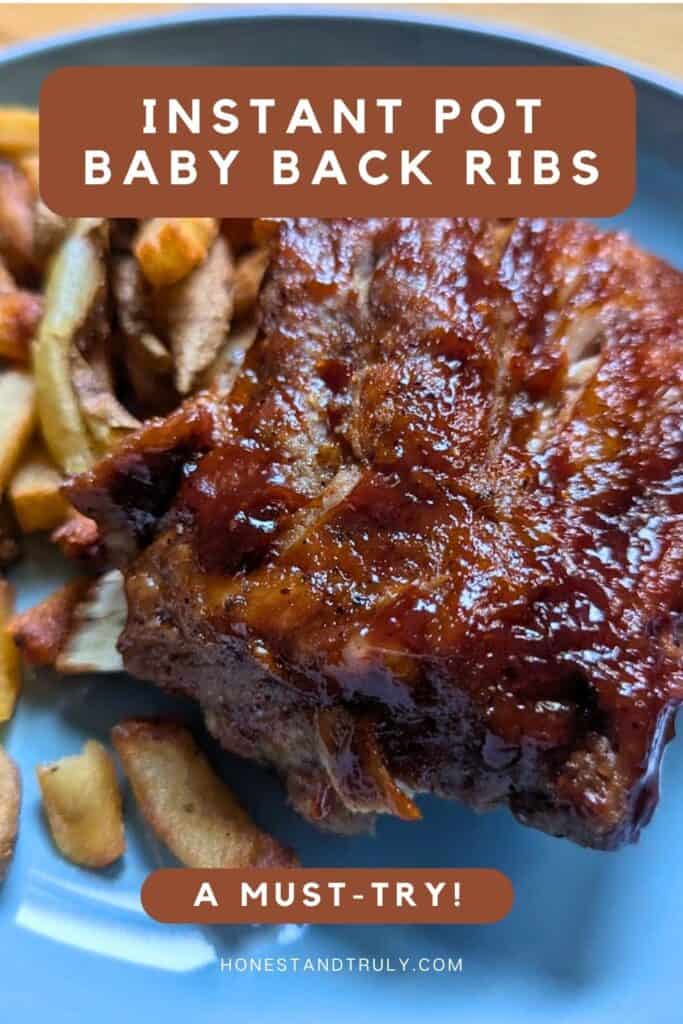 Image shows close-up of tender baby back ribs on a plate.