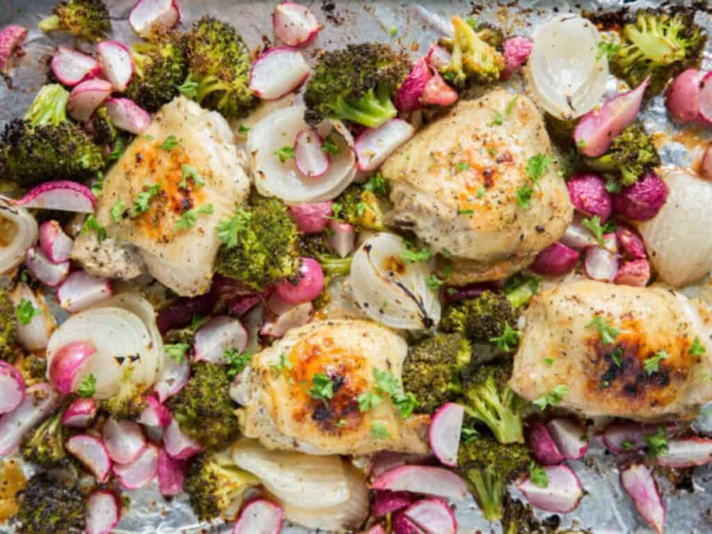 Image shows delicious sheet pan chicken and vegetables.