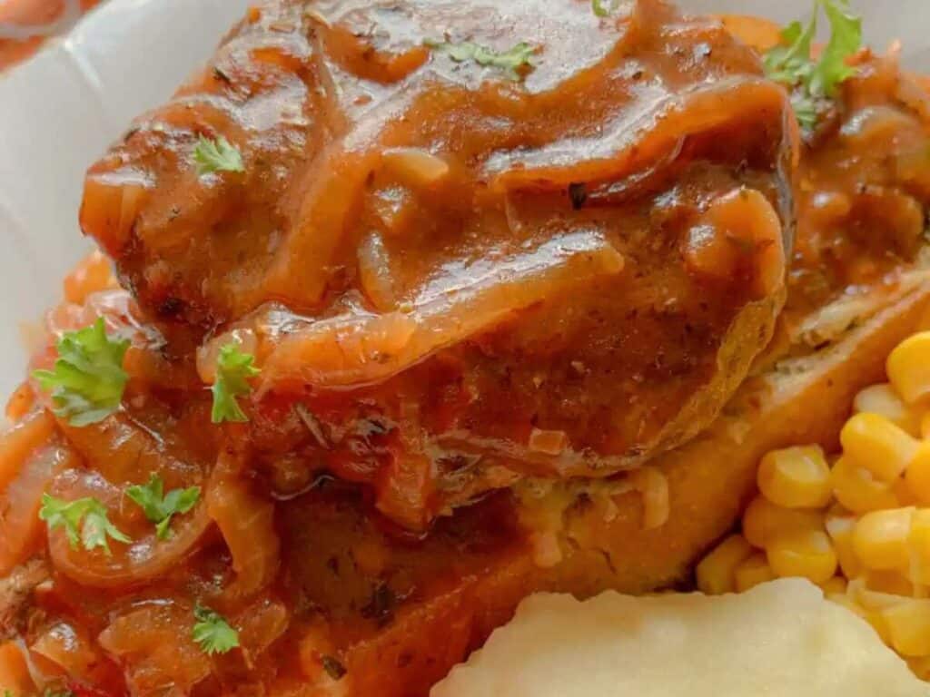 Image shows delicious french onion salisbury steak.