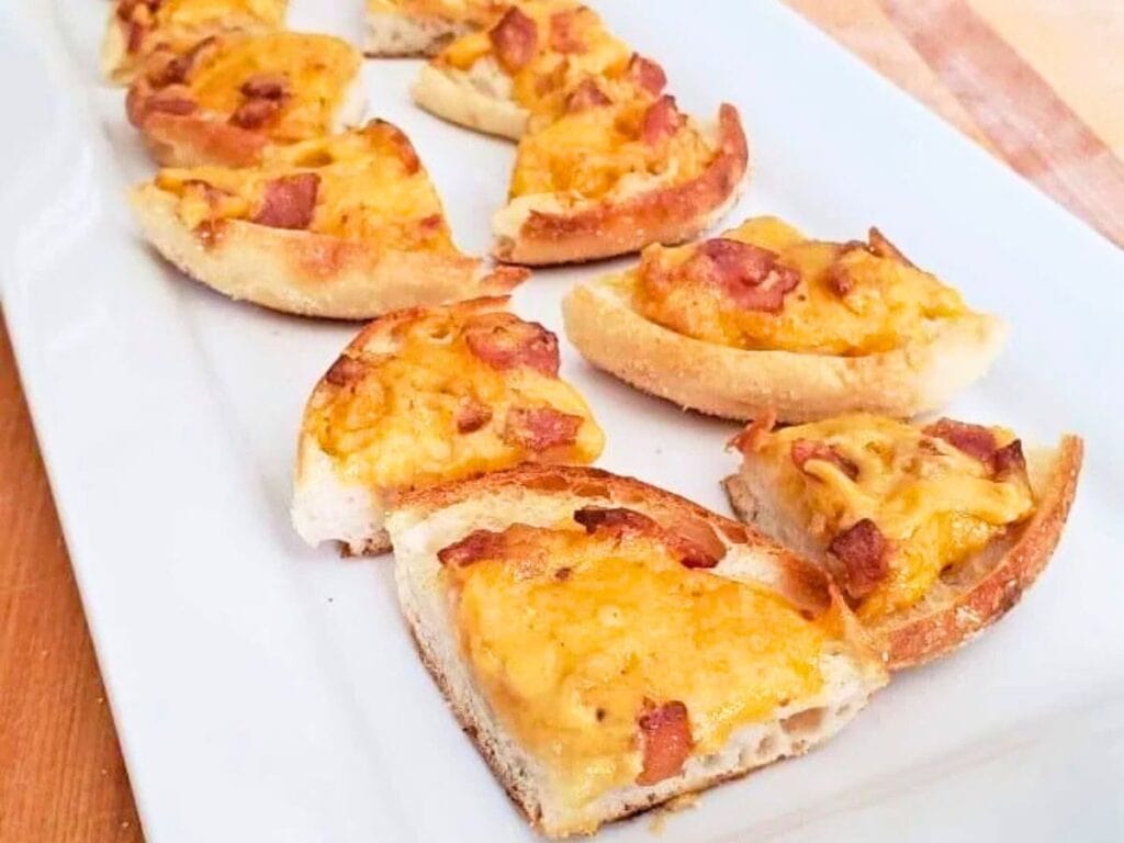 Image shows easy to make boozy bacon cheddar bites.