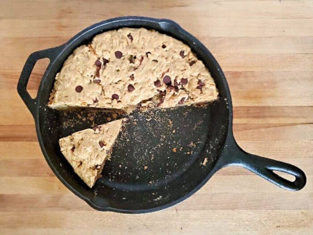 Image shows slice of delicious chocolate chip skillet cookie.