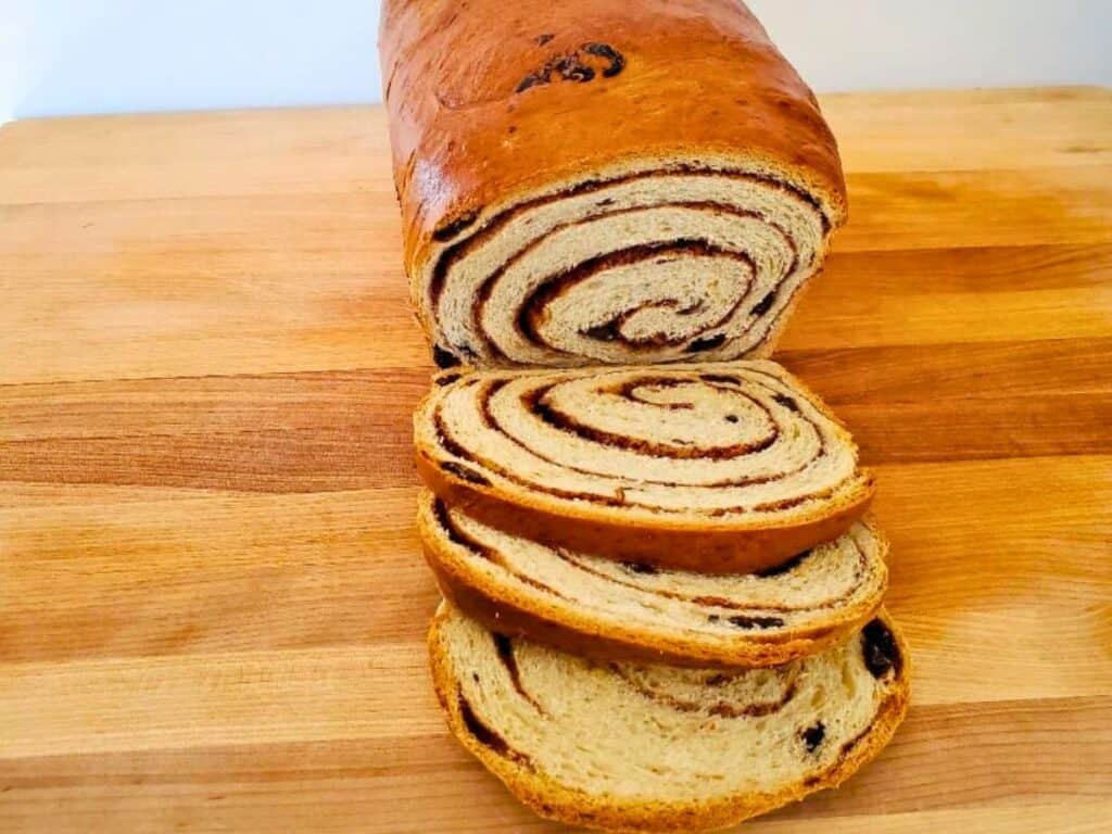 Image shows slices of easy to make cinnamon raisin bread.