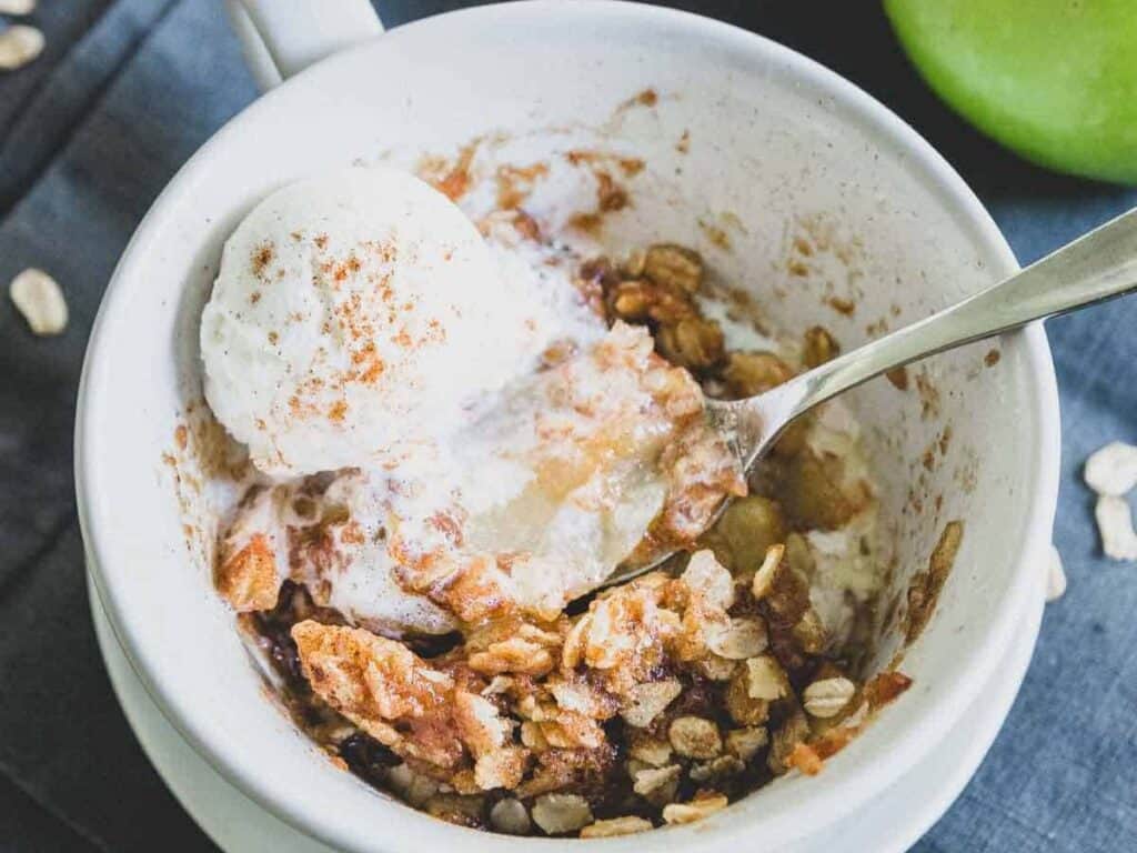 Image shows delicious microwave apple crisp.