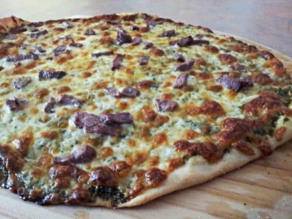 Image shows easy to make chimichurri pizza.